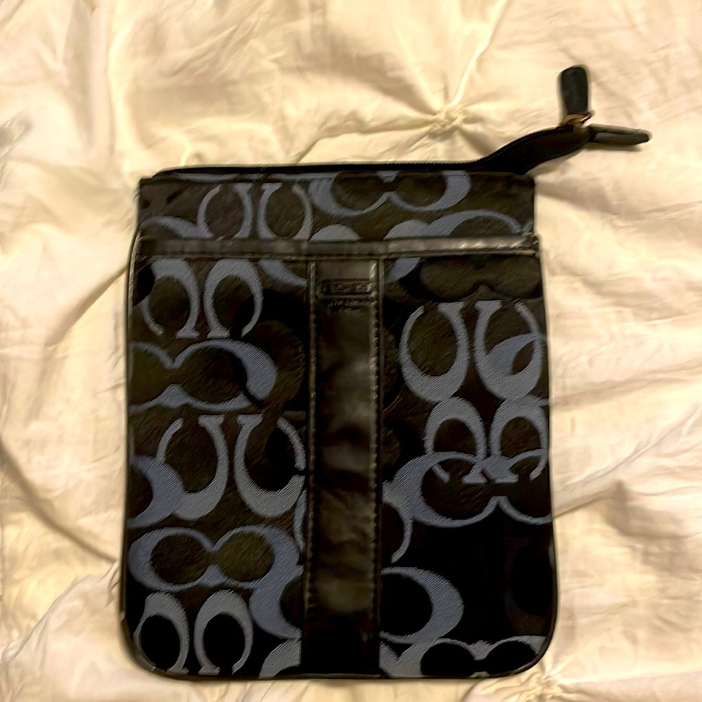 Used coach measuring 8 1/2” x 7” navy blue l am not pos  of its authenticity